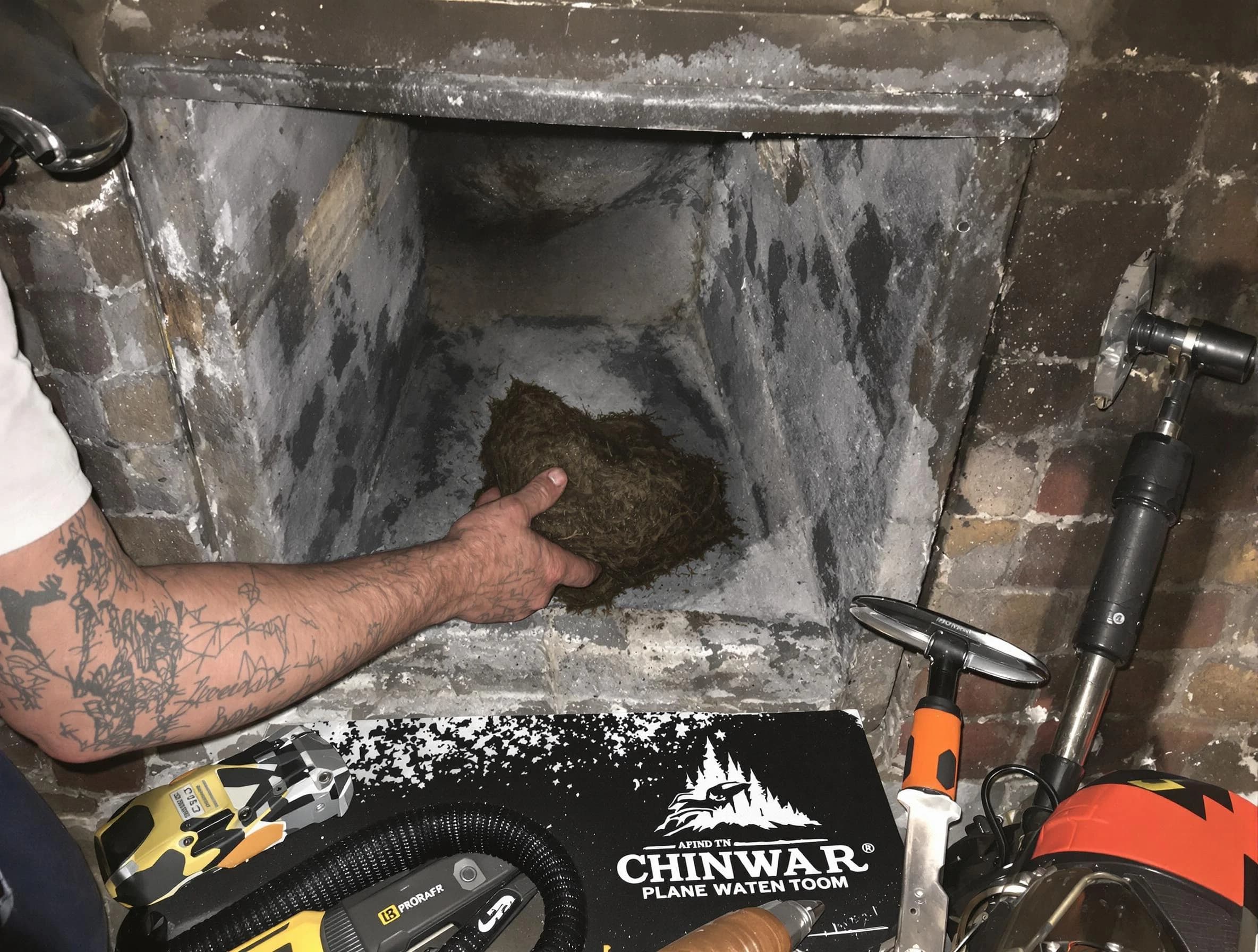 Riverdale Chimney Sweep safely removing debris and screening chimney in Riverdale, GA